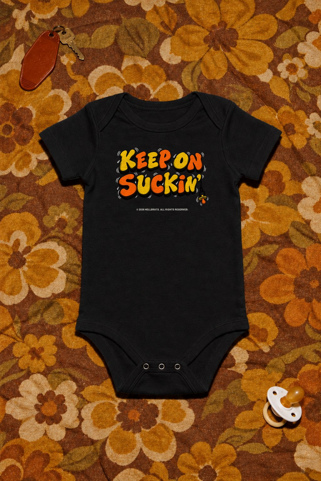 KEEP ON SUCKIN' onesie Black photo